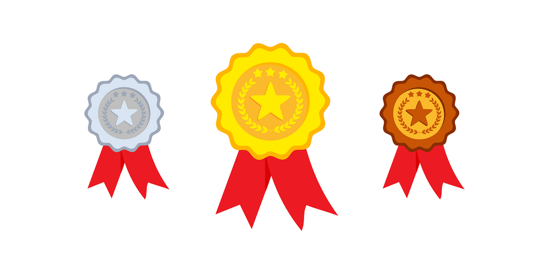 dessin de trois médailles, argent, or et bronze sur fond blanc